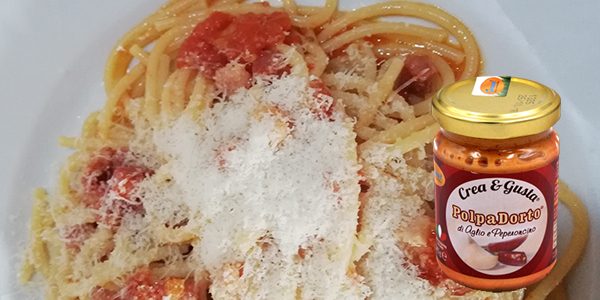 Polpadorto aglio e peperoncino con spaghetti alla pancetta